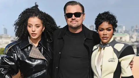 Getty Images Chase Infiniti, Leonardo DiCaprio and Teyana Taylor attend the London Photocall for "One Battle After Another" on September 15, 2025 in London, England. 