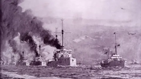 Universal History Archive/Getty Images Artwork showing a range of steaming ships of the German High Seas Fleet along with a passing  airship and biplane.