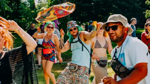 Nathan Roach/Shindig Festival People dancing in colourful outfits, shorts and dresses