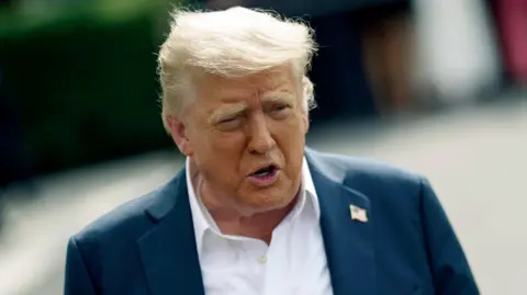 US President Donald Trump speaks to the media before leaving the White House on board Marine One, in Washington