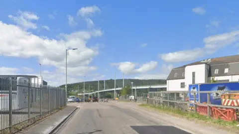 Longman Drive - there's an industrial estate on either side of the road and the Kessock Bridge is in the background.