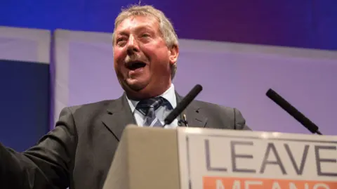 Getty Images Sammy Wilson speaking at a 'Leave Means Rally'