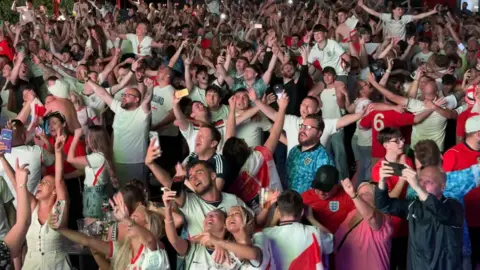 Crowd full of England football fans celebrating