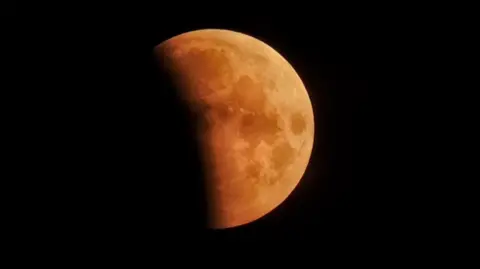 View of eclipse in the sky in Charlton Mackrell, Somerset