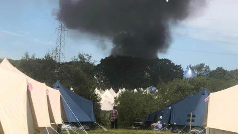 Smoke overhead at the Isle of Wight Festival