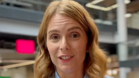 Kate Morgan, who has light brown shoulder length hair and brown eyes