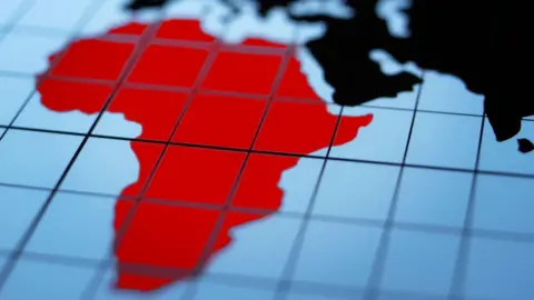 An outline in red of a map of the African continent.