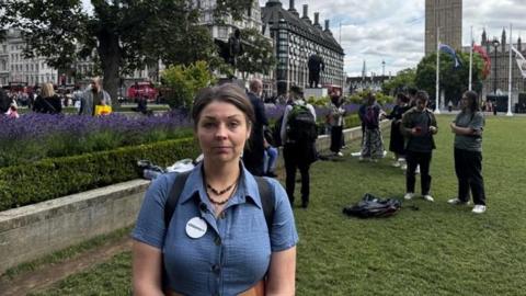 Former carer Suzie Lyle rallying in Parliament Square with Citizens UK