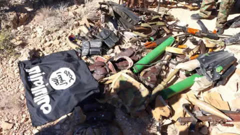 BBC/Amensisa Ifa Weapons with the black flag: This picture is another weapons captured by the army during the Great Loses Battle on 5th Feb 2025.