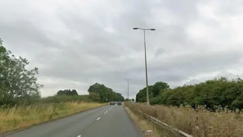 Dual carriageway with trees either side