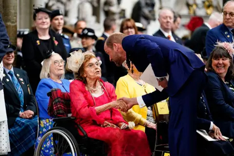 Jordan Pettitt/PA Media The Prince of Wales speaks with Second World War veterans and guest following a service of thanksgiving at Westminster Abbey in London on the 80th anniversary of VE
