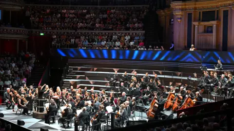 The BBC National Orchestra of Wales conducted by Nil Venditti perform Grace Williams: Concert Overture, Karl Jenkins: Stravaganza (Jess Gillam: soprano saxophone), Louise Farrenc: Overture No. 1 and Ludwig van Beethoven:
Symphony No. 7 in A major, broadcast live on BBC Radio 3 from the Royal Albert Hall on Monday 12 Aug 2024