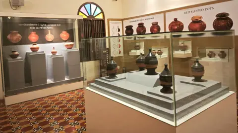 Black and black pottery was placed from the site in a glass show box in the Kiladi Museum, Tamil Nadu