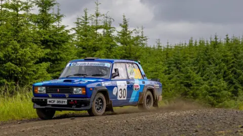 Shane McGirr and Denver Rafferty driving a Lada Riva VFTS through the Falstone Forest stage of the 2024 Kielder Forest Rally.