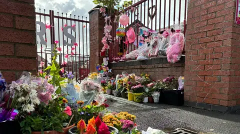 Flowers outside the school gates of Farnborough Road School