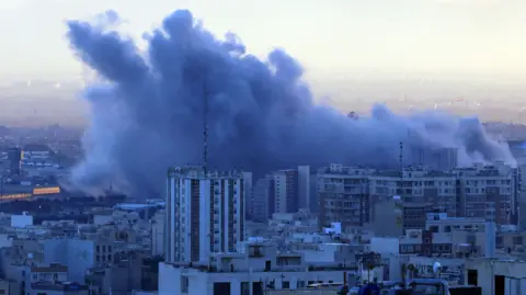 ABEDIN TAHERKENAREH/EPA/Shutterstock Smoke rises after an airstrike in central Tehran, Iran, 03 March 2026.