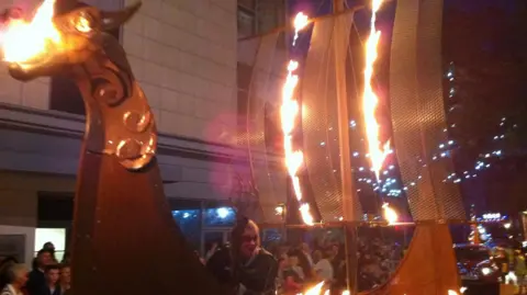 Steve Saul/BBC Torchlight procession featuring a Viking longboat in the 2012 Preston Guild