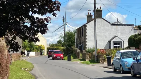 Wind turbine seen from the village of Tallentire, Cumbria