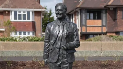 PA Media A statue of Sir David Amess