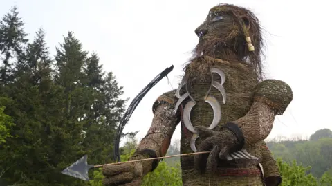 Wicker man with bow and arrow at Green Man Festival
