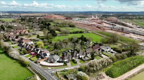 A drone image of Attleboro Lane shows how the properties gardens back on to the HS2 site, with mounds of earth and concrete seen in the distance.