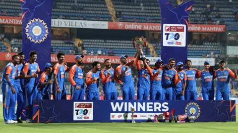 India celebrate their T20 series win against England