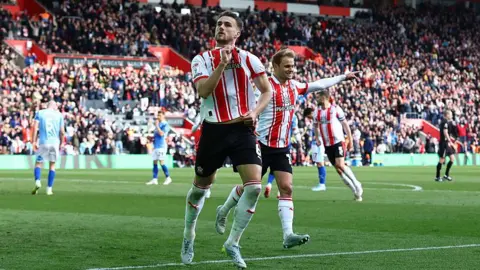 Taylor Harwood-Bellis and Leo Scienza celebrate after scoring