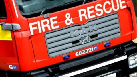 NIFRS Image shows a close-up shot of the front of a fire engine with the words 'fire and rescue' on the front