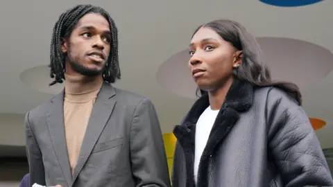 PA Media Athletes Bianca Williams and Ricardo Dos Santos outside Palestra House, central London, after the judgement was given in October