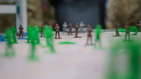 BBC/Matthew Goddard Plastic soldiers - some green, some brown