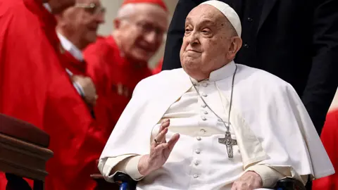 Reuters Pope Francis greets cardinals with a wave from a wheelchair
