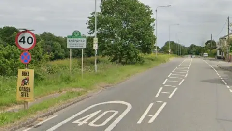 Street image of the A512 with a sign that reads SHEPSHED
