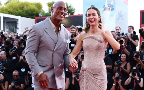 Getty Images Dwayne Johnson and Emily Blunt attend "The Smashing Machine" red carpet during the 82nd Venice International Film Festival on September 01, 2025 in Venice, Italy.