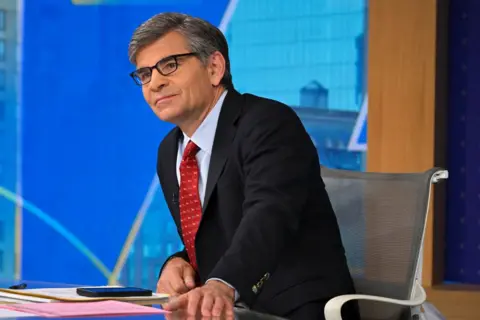 Getty Images George Stephanopoulos sits at the ABC News anchor's desk