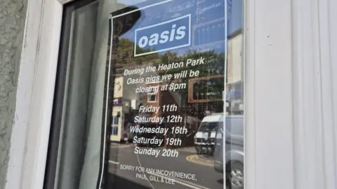 BBC Sign on pub window saying it will shut at 8pm on the nights of the Oasis gigs