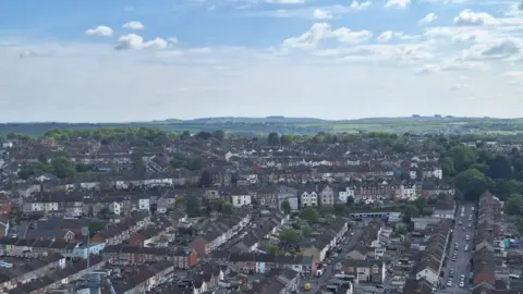 LDRS Birds-eye view of a residential area in Swindon with the countryside in the far distance