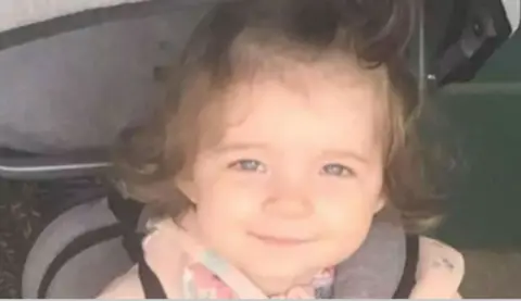 Head-and-shoulders image of Isabelle Rose Welsh. She is smiling directly into the camera and has dark hair. She is wearing a pink top.