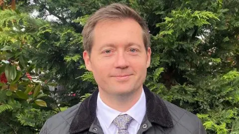 Richard Thomson Richard Thomson in a shirt and tie 