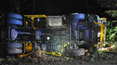 Princetown Fire Station The grit coming from the overturned grit lorry.