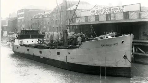 Lilian Ream Exhibition Gallery  Cargo ship next to fruit and potato warehouse