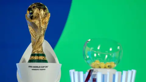 Fifa World Cup 2026 Winner's Trophy is seen on the colourful set of the draw last week