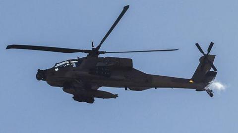 An Apache helicopter in the Strait of Hormuz