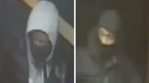 Two men on CCTV images, one with a grey hoodie and a face mask while the other is wearing a balaclava.