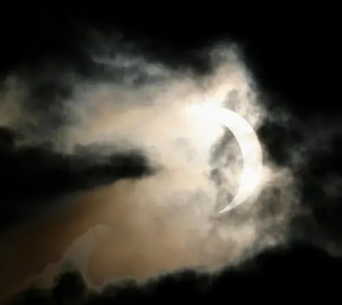 BBC Weather Watcher Clouds moving over a partial solar eclipse