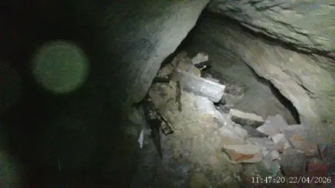 Supplied A view of a cave filled in with rubble.