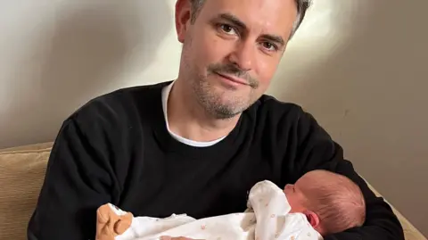 Jon Pearce with his daughter