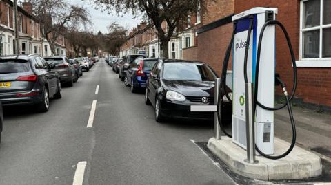 A terraced street and EV chargepoint