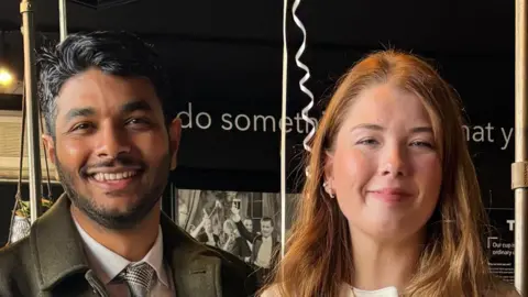 Supplied A close-up, head and shoulders image of Gouse Subhan Saheb and Katie Molloy. They are both smiling and looking into the camera.

