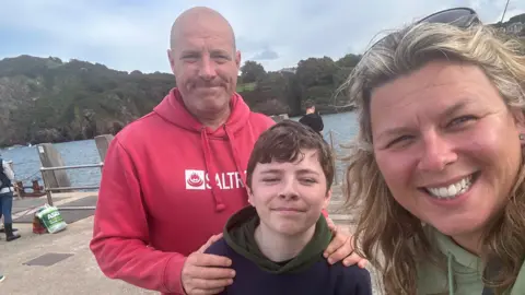 EMMA O'BRIEN Emma, Ben and Leo O'Brien smile into the camera on a family holiday.