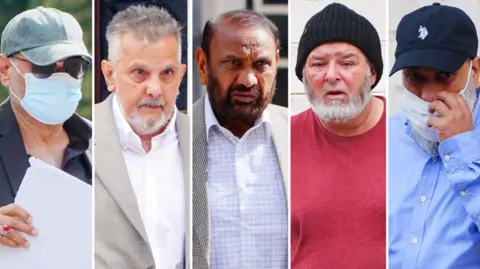 PA Media A composite image of five men outside court. They are all head and shoulder shots. The man on the far left has a mask on, cap and sunglasses and holds papers. The one next to him has greying hair and a beard with a white shirt and grey blazer, next to him the man has dark hair and facial hair and white striped shirt. Next to him the man has a black woolly hat and red t-shirt and far right the man has a dark blue cap, blue shirt and a mask over his face. The man on the far left wears a blue three piece suit and has white hair, the one second left has dark black hair with glasses, he has a maroon blazer and pinstriped shirt, the man next to him has a three piece blue suit, he has a white goatee and shaved head, the man on the right has a blue suit on with a white shirt and red tie.